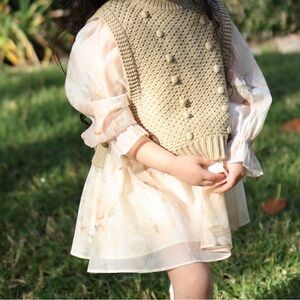 Elegant Cream Knit Vest and dress